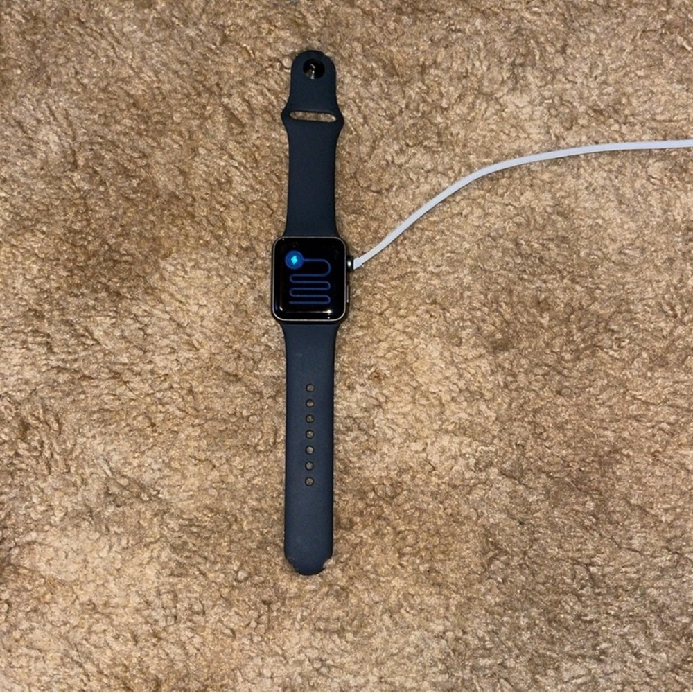 Black Apple Watch with Charging Cable
